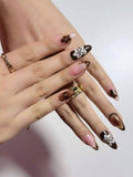 Brown flower press on nails with gradient tips, perfect for daily use, office and holidays. Medium length almond shape fake nails with delicate floral design.