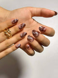 Warm brown coffee marble press on nails with natural stone effect and smooth glossy finish. Perfect for daily use, office, parties, dates and holidays. Short length round shape fake nails with a chic, minimalist design.