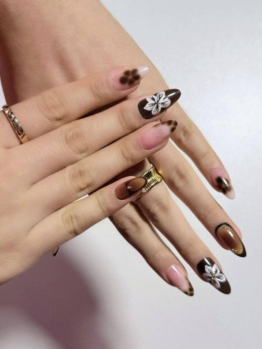 Brown flower press on nails with gradient tips, perfect for daily use, office and holidays. Medium length almond shape fake nails with delicate floral design.