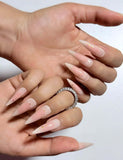Soft blush-effect press on nails in white and pink tones, with delicate gold star accents. Perfect for daily use, office and holidays. Long stiletto shape fake nails with a dreamy, ethereal finish.